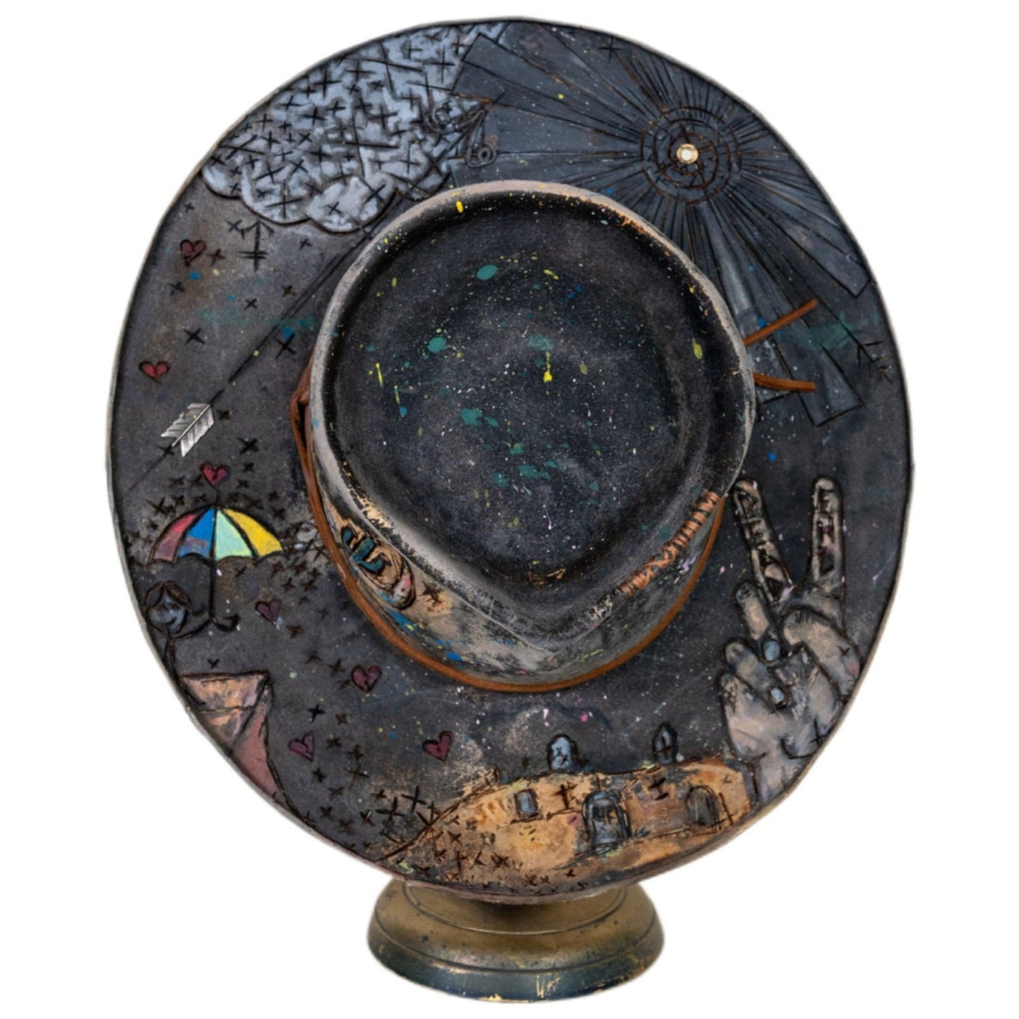 Close-up of distressed black fur felt texture with burned markings
