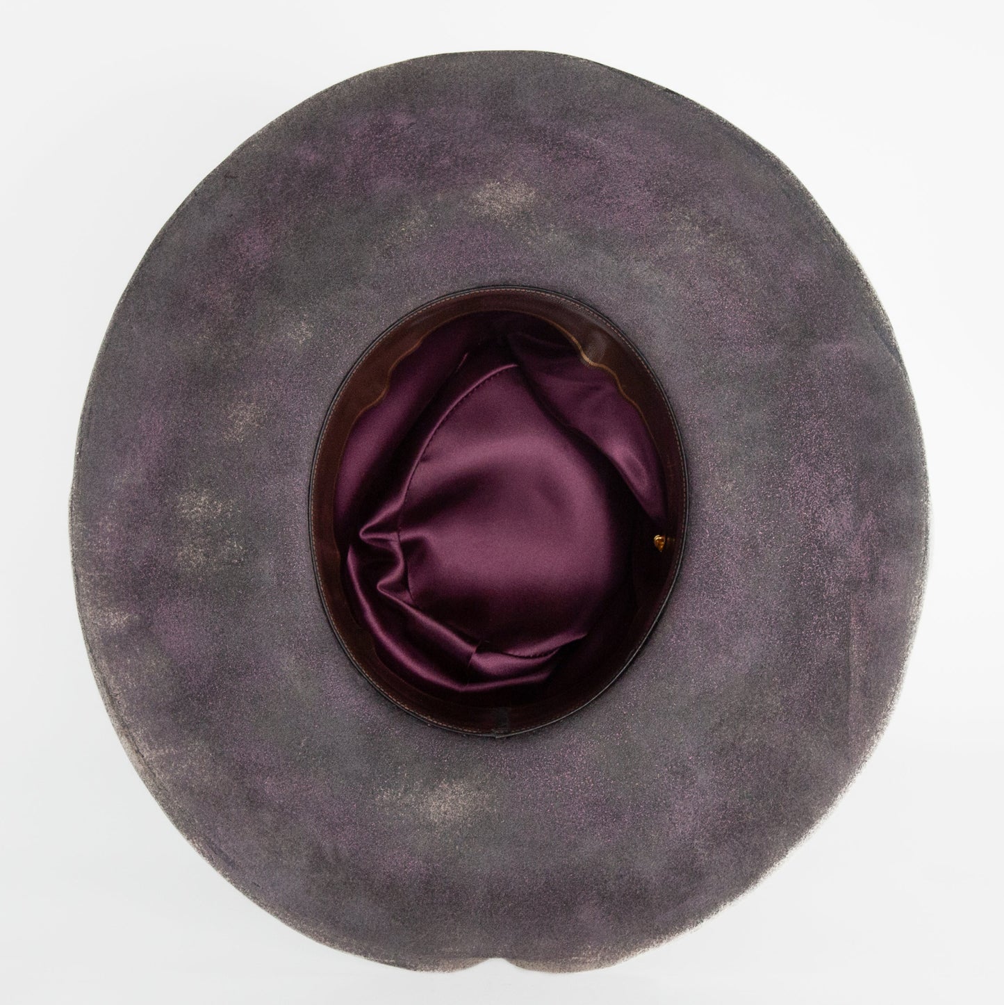 Close-up of distressed rabbit and beaver blend fur felt in charcoal and clay tones
