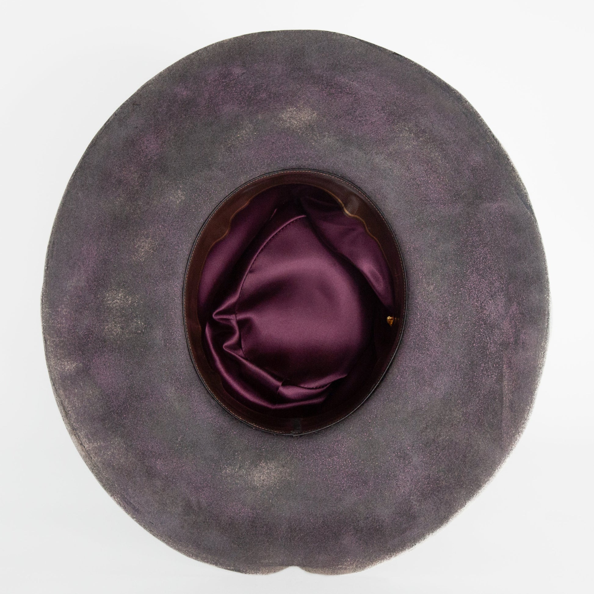 Close-up of distressed rabbit and beaver blend fur felt in charcoal and clay tones
