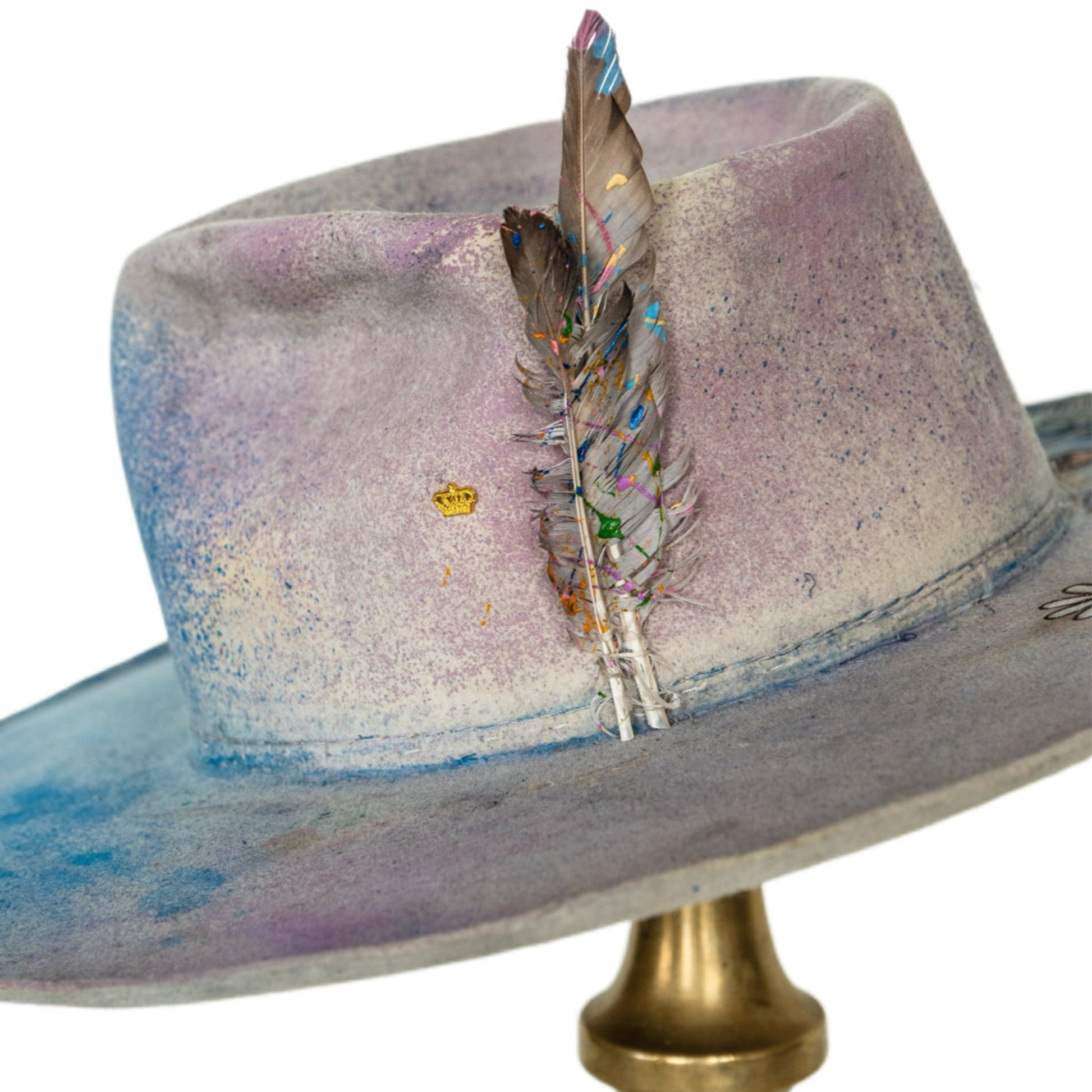Lumen distressed fur felt hat showing curled brim and layered color variation