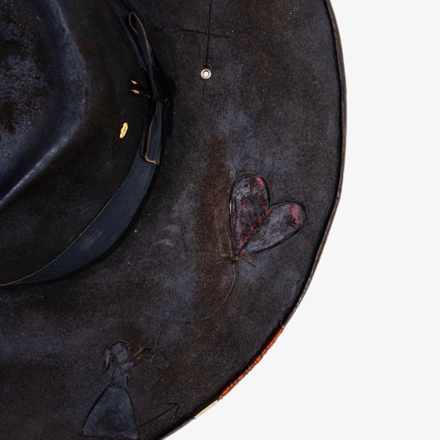 Close-up of heavily distressed chocolate brown beaver fur felt texture
