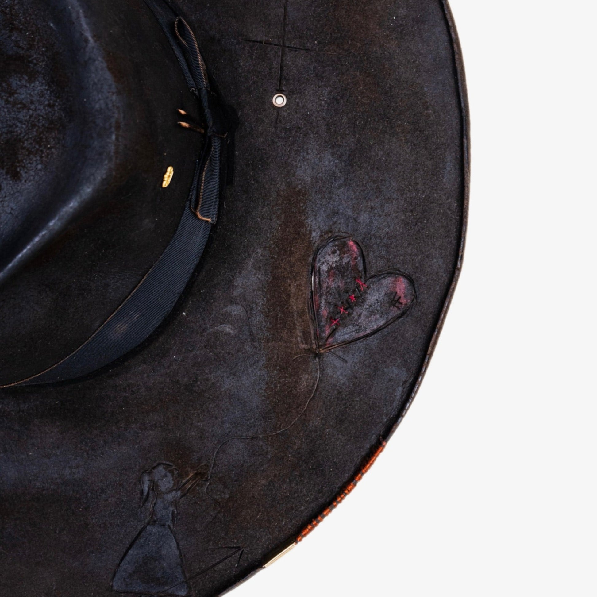 Close-up of heavily distressed chocolate brown beaver fur felt texture
