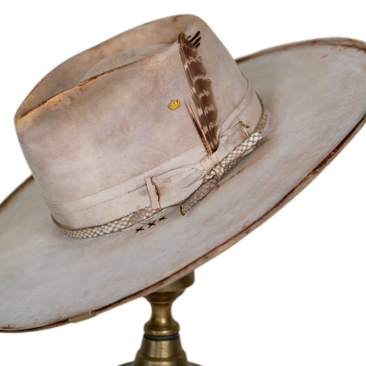 Noelle bone beaver felt hat with gold crown pin, pen, feather, and wire-wrapped toothpicks
