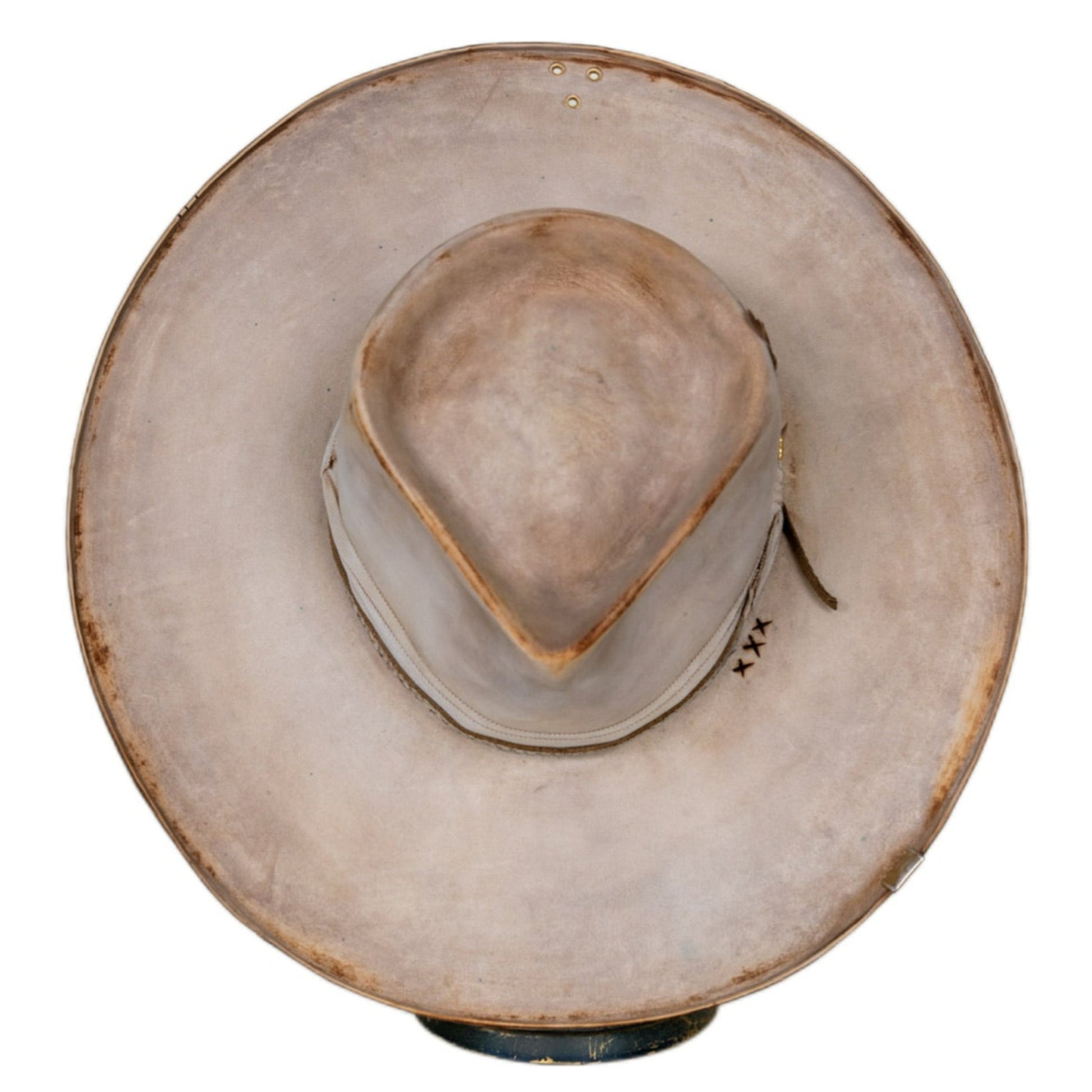 Close-up of hand-distressed bone beaver fur felt texture
